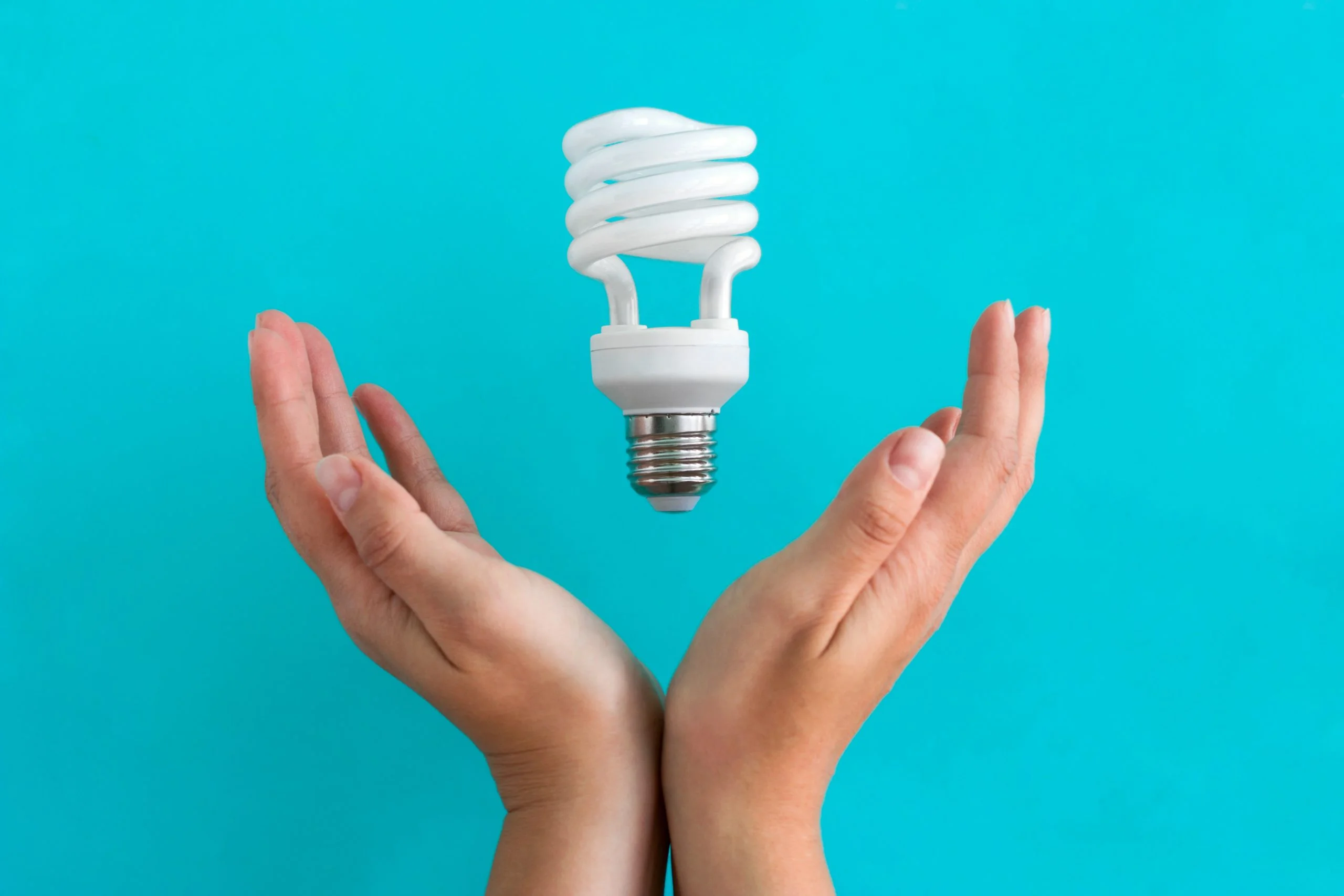 women holding a light bulb